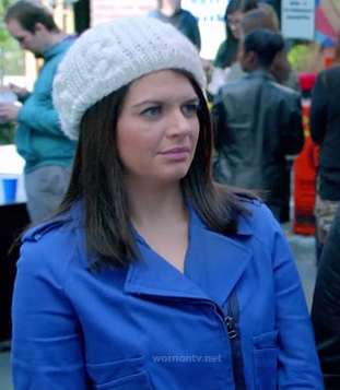 Penny’s cobalt blue moto jacket and white knit beanie on Happy Endings