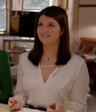 Penny’s white v-neck split blouse on Happy Endings