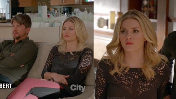 Alex's black laser cut out top and red/black jeans on Happy Endings