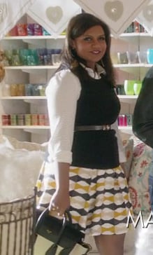 Mindy’s yellow geo print skirt with white shirt on The Mindy Project