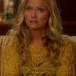Chloe’s yellow knit sweater on The Goodwin Games
