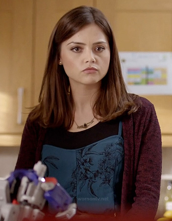 Clara’s blue printed dress and burgundy cardigan on Doctor Who