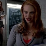Jessica’s grey cardigan with striped sleeve, mini skirt and black bag on True Blood