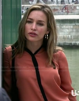 Annie’s orange shirt with black trim on Covert Affairs