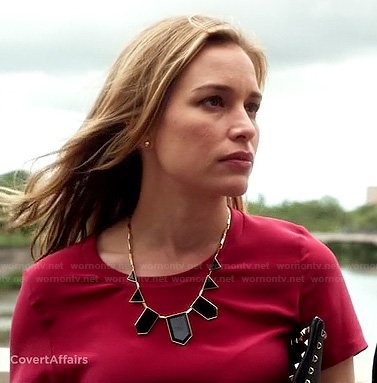 Annie’s red top, black geometric necklace and studded clutch on Covert Affairs