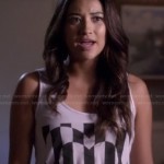 Emily’s white tank top with black striped heart graphic on Pretty Little Liars