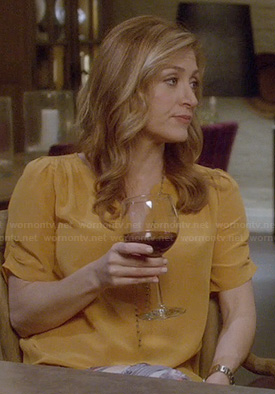 Maura’s yellow split neck blouse with ruched sleeves on Rizzoli and Isles