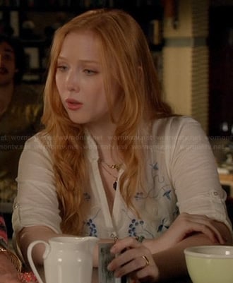 Alexis’s white and blue embroidered top on Castle