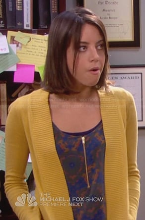 April's brown and blue printed zip front top on Parks & Rec