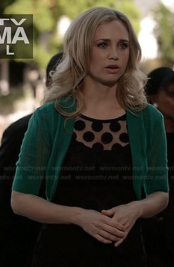 Jenna’s black polka dot dress and green shrug on Wilfred