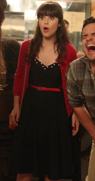 Jess’s navy sweetheart dress with polka dot trim with red cardigan and belt on New Girl
