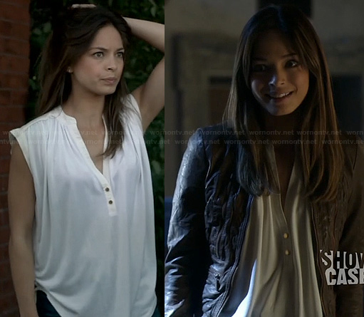 Cat’s white two-button blouse and tan leather jacket on Beauty and the Beast