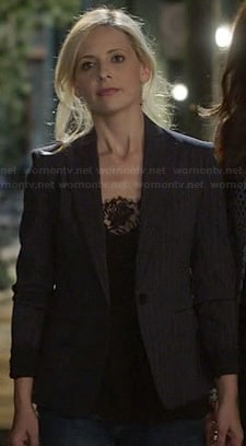 Sydney’s black lace cami and dark pinstripe blazer on The Crazy Ones