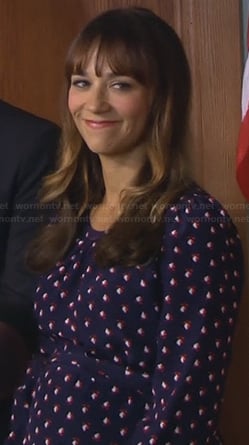 Ann’s navy blue dress with red print on Parks and Recreation