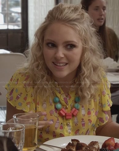 Carrie’s yellow people-printed blouse on The Carrie Diaries