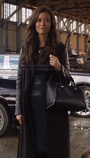 Isabelle’s long coat with leather sleeves and green leather trim dress on Arrow