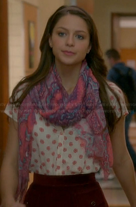 Marley’s white and red printed top and burgundy skirt on Glee