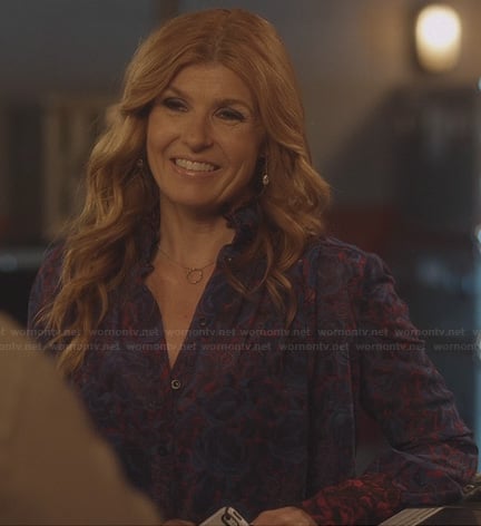 Rayna’s purple and red floral printed blouse with red ruffle collar on Nashville