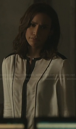 Tess’s white blouse with black contrast trim on Beauty and the Beast