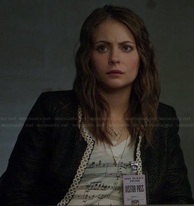 Thea’s musical notes print t-shirt and black jacket with white trim on Arrow