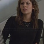 Thea’s black speckled long-sleeve dress and heart necklace on Arrow