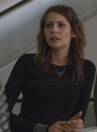 Thea’s black speckled long-sleeve dress and heart necklace on Arrow