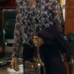 Vanessa’s blue floral blouse, elbow patch blazer and black bag on Last Man Standing
