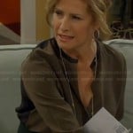 Vanessa’s olive green blouse with black trim and back on Last Man Standing