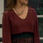 Vanessa’s red long sleeve blouse and tweed skirt on Last Man Standing