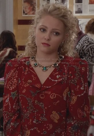Carrie’s red printed jacket and green flower necklace on The Carrie Diaries