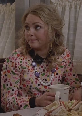 Carrie’s multi-colored print blouse with black collar on The Carrie Diaries