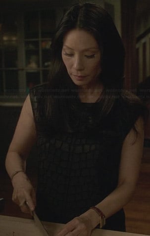 Joan’s textured leather dress on Elementary