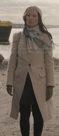 Joan’s cream asymmetrical coat on Elementary