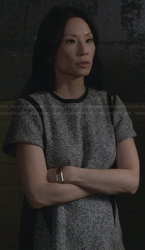Joan’s grey dress with leather details on Elementary