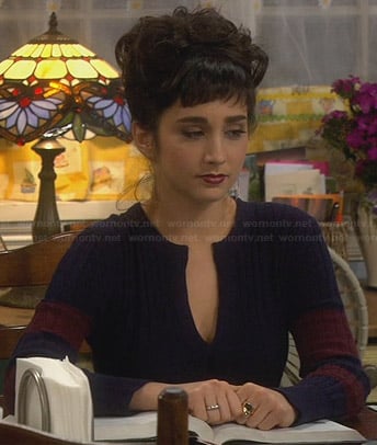 Mandy’s navy and burgundy cable knit sweater with split neck on Last Man Standing