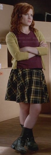 Tessa’s plaid skirt with yellow cardigan and calf boots on Suburgatory