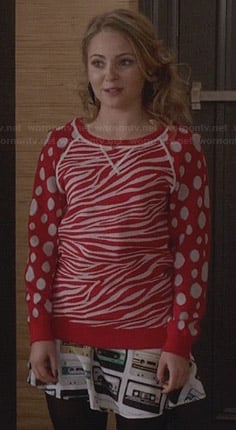 Carrie’s red zebra and polka dot sweater with cassette tape skirt on The Carrie Diaries