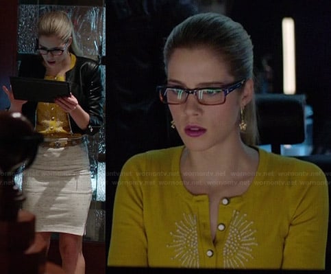 Felicity’s yellow beaded cardigan and white side-zip skirt on Arrow