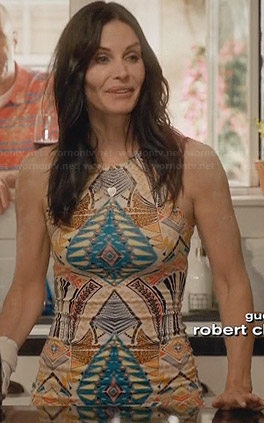 Jules’s yellow printed dress and gold cork wedges on Cougar Town