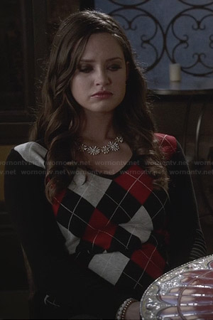 Olivia’s red and black argyle sweater on Ravenswood