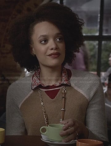 Remy’s tan and grey sweater with red trim on Ravenswood