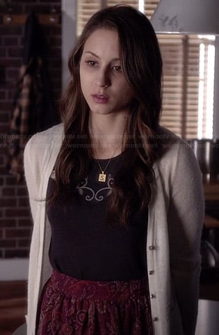 Spencer’s red paisley printed high-low skirt, black embroidered top and “S” necklace on Pretty Little Liars