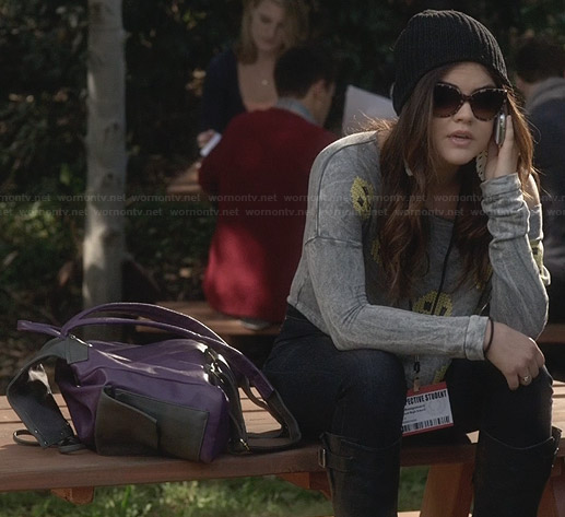 Aria’s smiley face sweatshirt with open back on Pretty Little Liars