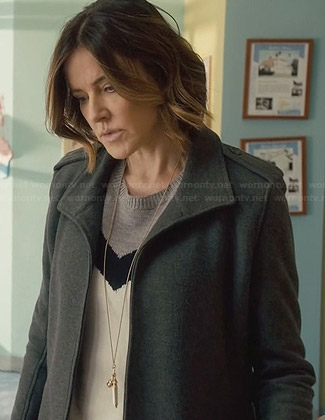Ellie’s tri-tone chevron sweater and grey coat on Cougar Town