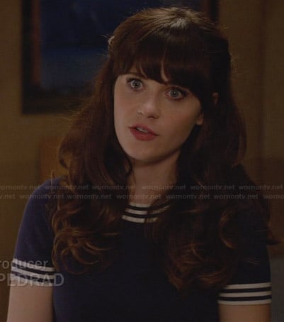 Jess’s blue top with striped trim on New Girl
