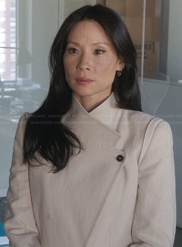 Joan’s cream asymmetric coat on Elementary