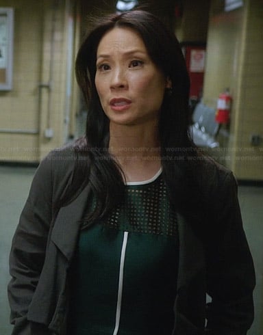 Joan’s green perforated dress with white trim on Elementary