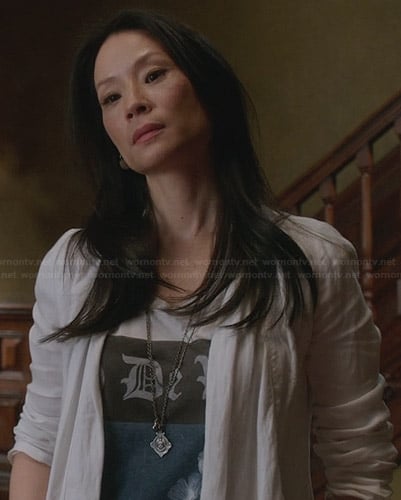 Joan’s white and blue graphic tee on Elementary