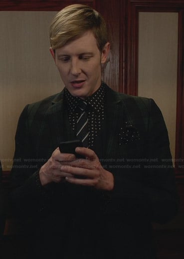 Nolan’s black shirt with small white print and green plaid blazer on Revenge