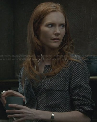 Abby’s black printed blouse and gold chain belt on Scandal